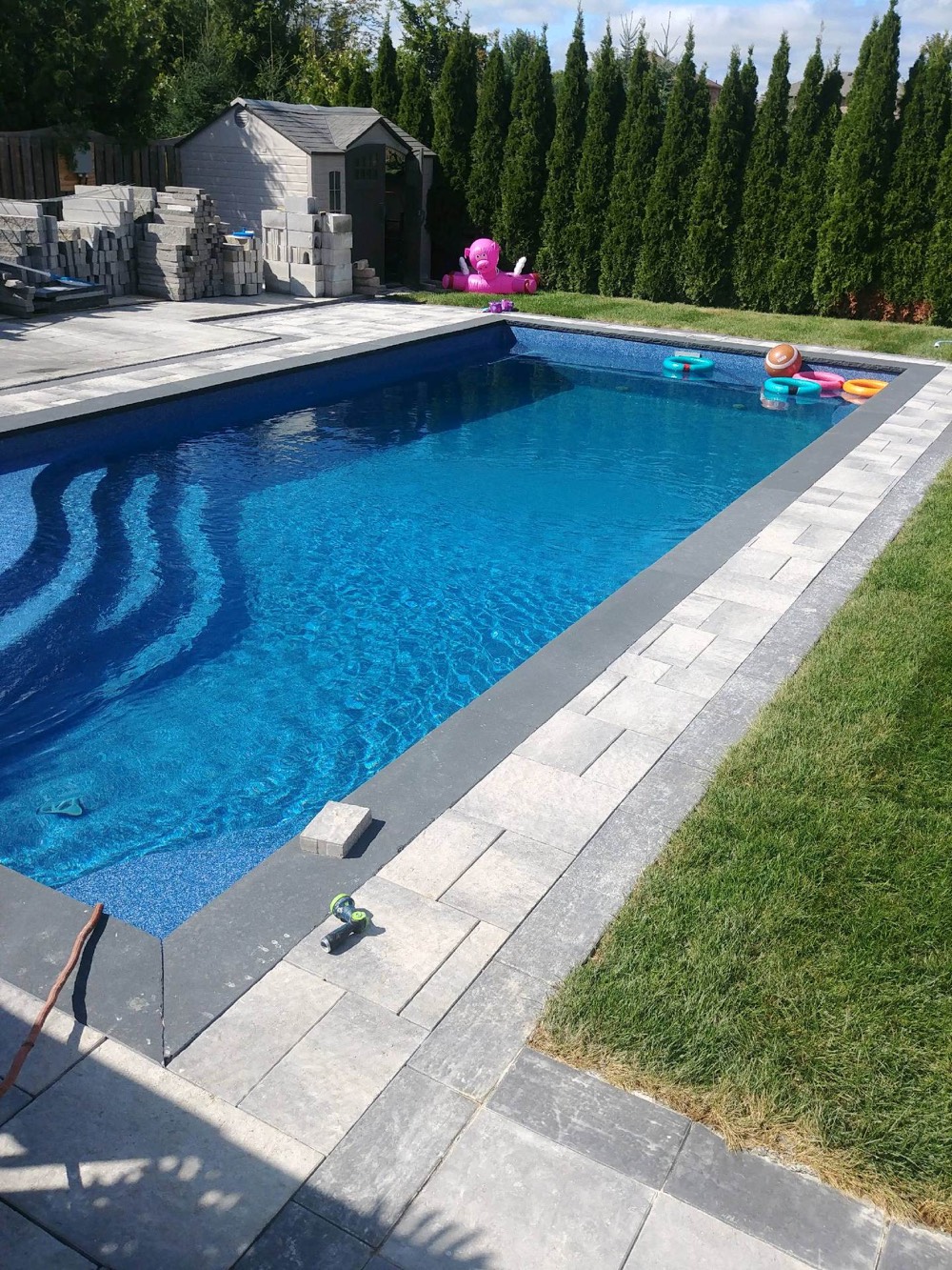 Fiberglass pool in a backyard