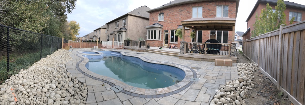 Fiberglass pool in a backyard