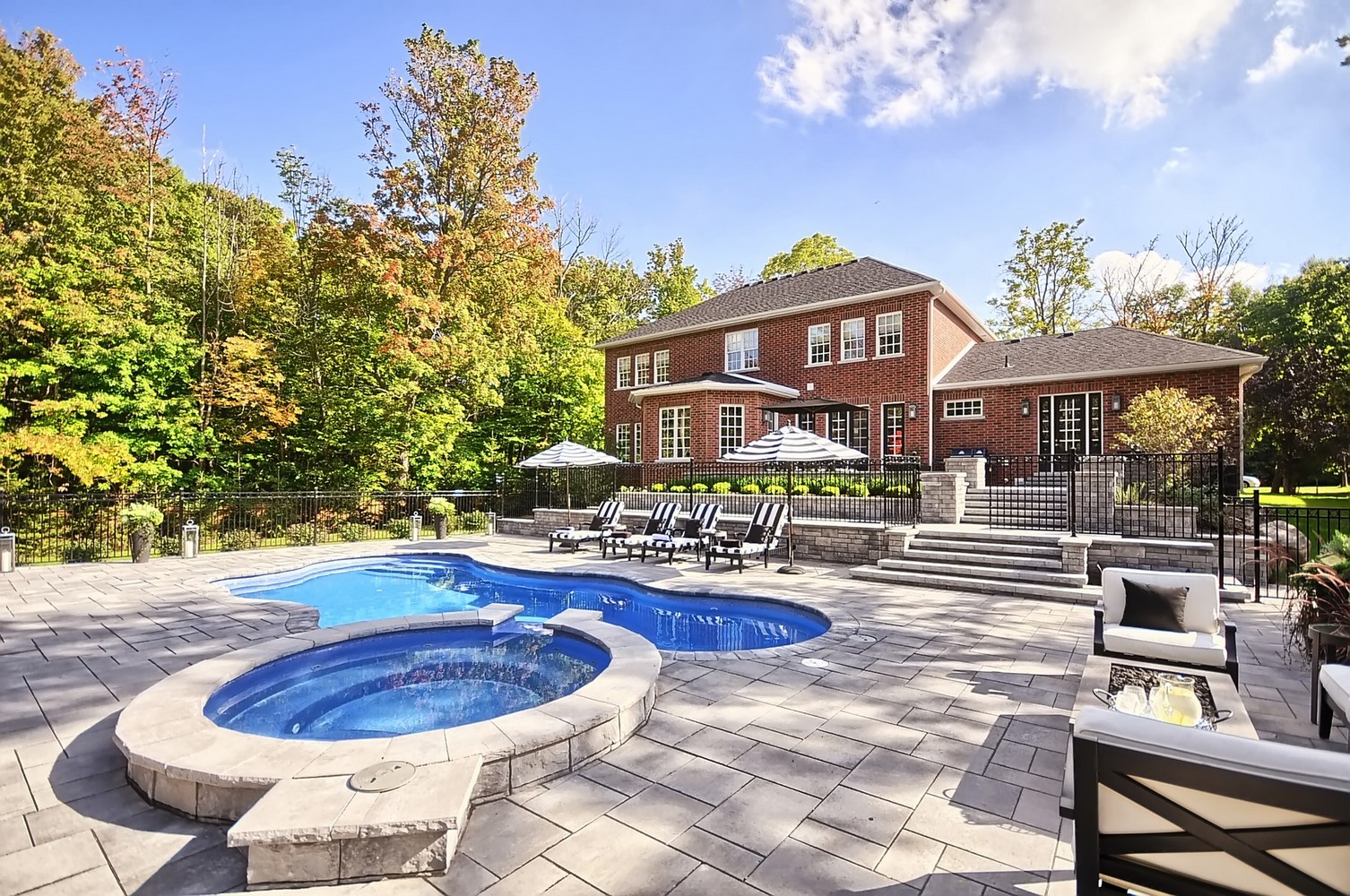 Fiberglass pool next to a hot tub