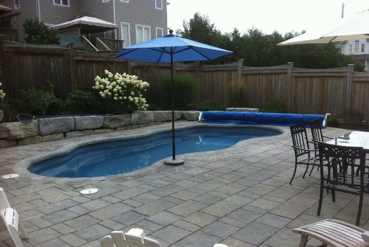 Fiberglass pool in a backyard