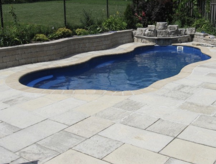 Fiberglass pool in a backyard