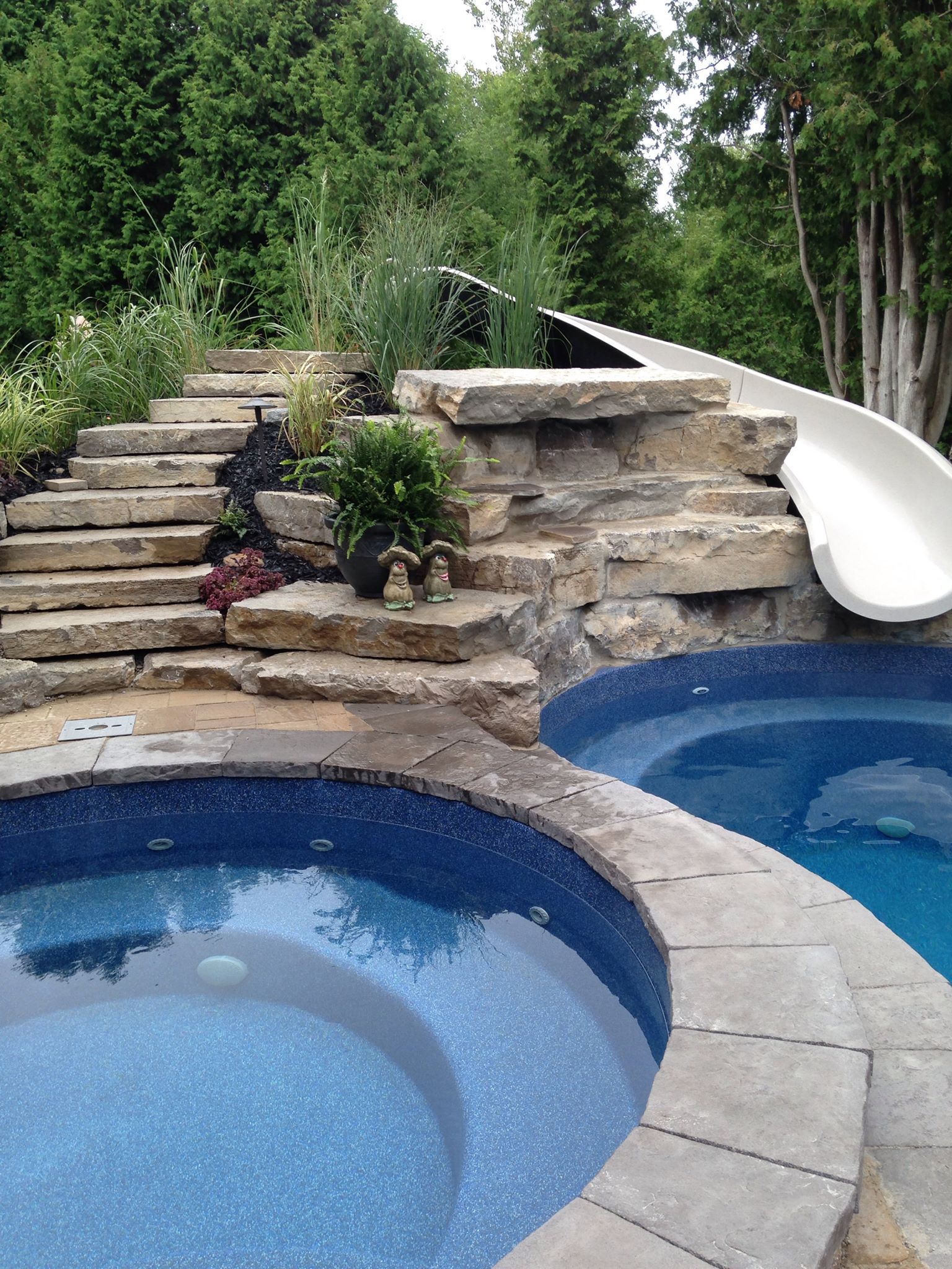 Fiberglass pool with a slide in Barrie, Ontario