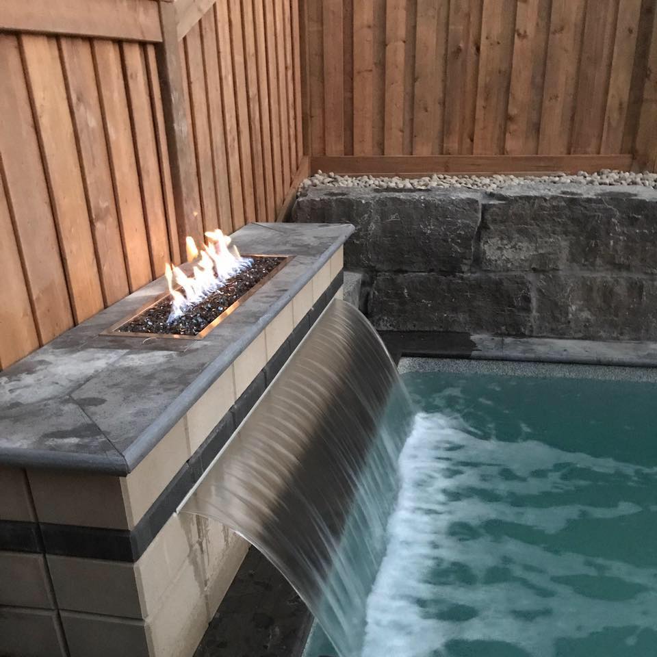 Fiberglass pool with a fireplace